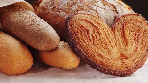 Bread displayed by the baker, assortment of Spanish baguette and traditional Stock Footage 232804281
