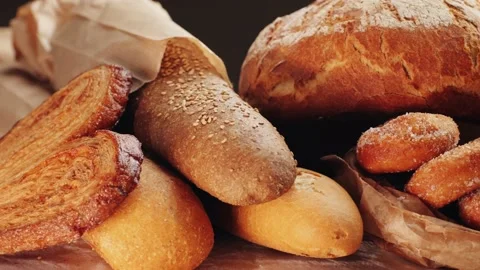 Bread displayed by the baker, assortment of Spanish baguette and traditional Stock Footage 237946308