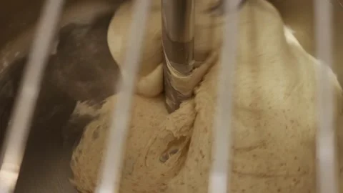 Bread dough being mixed in industrial mixer, kneading process in bakery kitchen Stock Footage 333512090