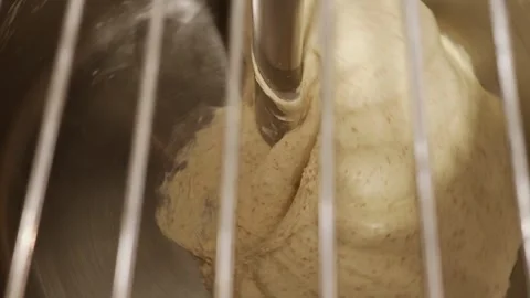 Bread dough being mixed in industrial mixer, kneading process in bakery kitchen Stock Footage 333512194