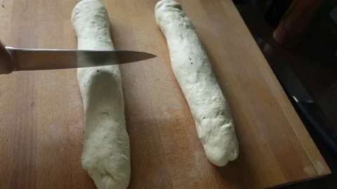 Bread dough cutting using kitchen knife, slo mo Stock Footage 89718625