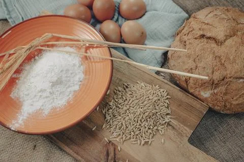 Bread dough with eggs and ingredients to make traditional rustic bread. Stock Photos
