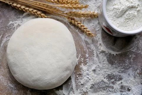Bread dough on flour Stock Photos
