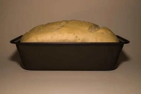 The bread dough has risen, the bread dough is ready for baking. Homemade yeast b Stock Photos