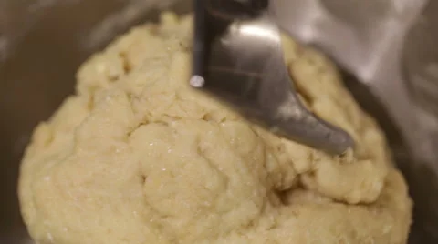 Bread dough kneading automatically using a machine. Stock Footage 68630684