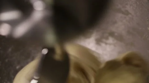 Bread dough kneading automatically using a machine. Stock Footage 68630691