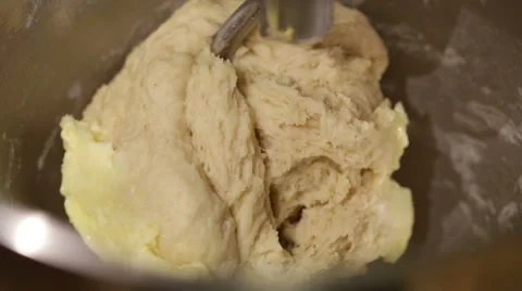 Bread dough kneading automatically using a machine. Stock Footage 68630693