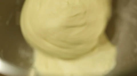 Bread dough kneading automatically using a machine. Stock Footage 68630703