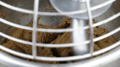 Bread dough mixture kneading in automatic kitchen appliance. Stock Footage 146860317
