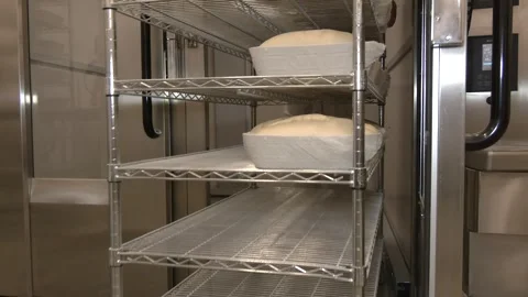 Bread Dough Proofing on Racks in Industrial Bakery Chamber Vídeo Stock 346472558