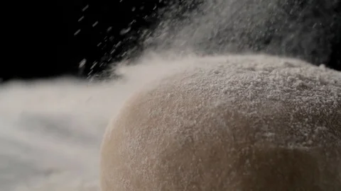 Bread dough sprinkled with flour, cooking in slow motion Stock Footage 105122159