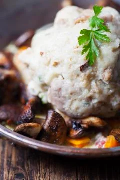 Bread dumpling with mushroom sauce Stock Photos