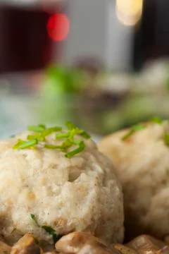 Bread dumpling with mushroom sauce Stock Photos
