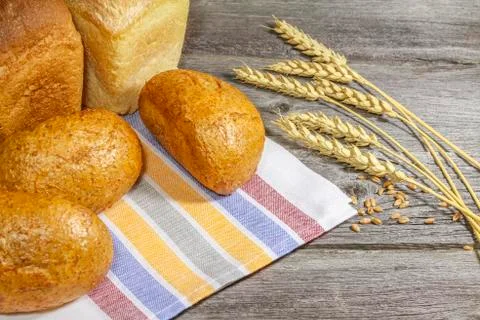 Bread with ears on the table Stock Photos