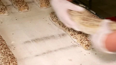 Bread factory. Manufacturing process of preparing baguettes to place in the oven Stock Footage 64471010