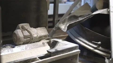 Bread falling from the conveyor line at the factory covered in flour Stock Footage 164472246