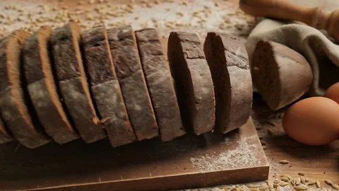 Bread falling in slow motion. Top view of wholegrain bread falling down. Stock-Footage 127338922