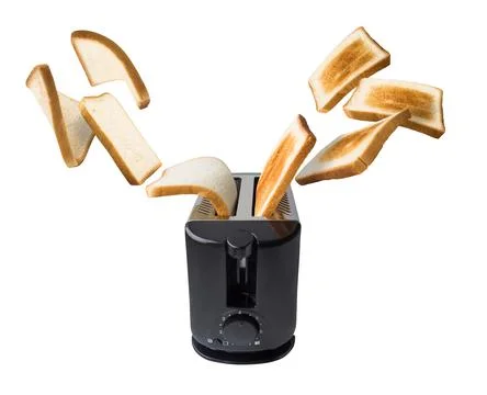 Bread falling in toaster Fotos Stock