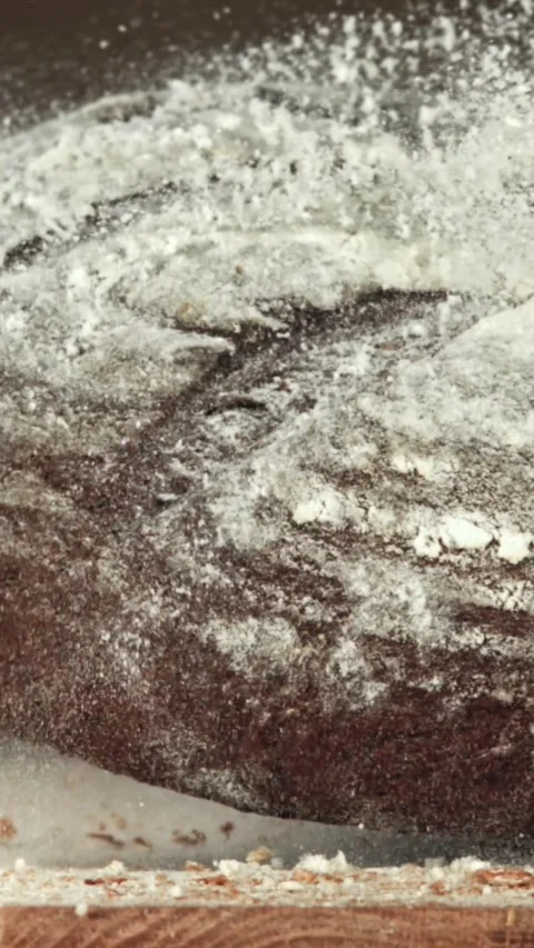 The bread falls on the table. Filmed on a high-speed camera at 1000 fps Stock Footage 335372211