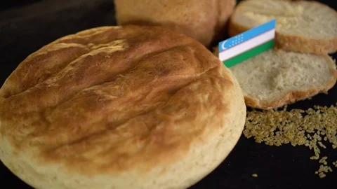 Bread with flag of Uzbekistan Stock Footage 101157194