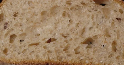 Bread with flax seeds, slice. Rotation on a black background Stock Footage 167218423