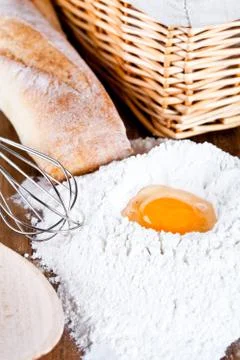 Bread, flour, eggs and kitchen utensil Stock Photos