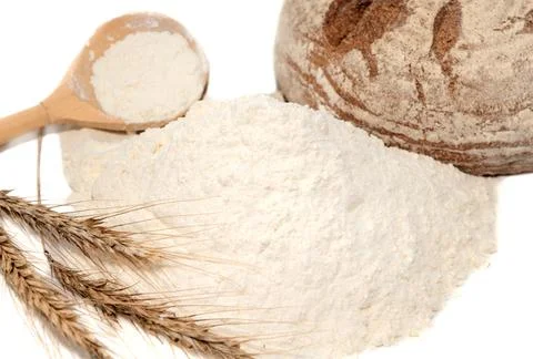 Bread, flour, spikelets of wheat on a white background. Flour Stock Photos