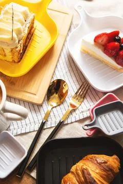 Bread, fork and spoon on the table Stock Photos