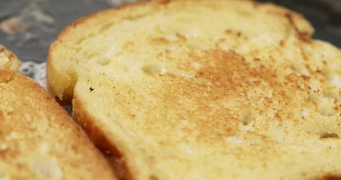 The bread is fried in butter or oil in a frying pan. Stock Footage 250177691