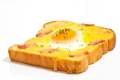 Bread with fried egg and ham Stock Photos