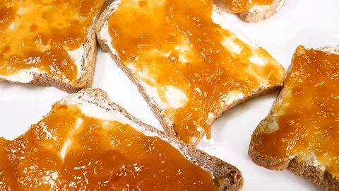 Bread with Fruit Jam Marmalade and Butter Video stock 122599899