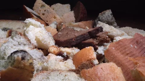Bread goes to waste. Oversupply of Bread, Leftover bread. The baked goods Stock Footage 186909760