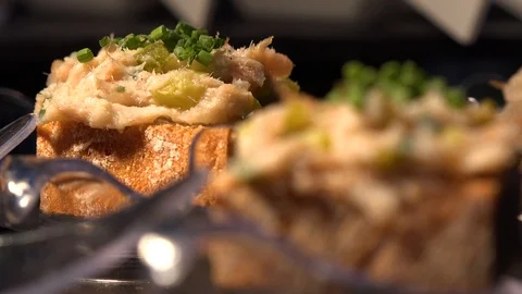 Bread with gourmet paste and herbs on a table - closeup Stock-Footage 87977073