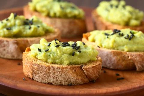 Bread with Green Pea Spread and Sesame Seeds Stock Photos