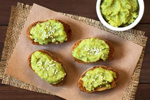 Bread with Green Pea Spread and Sesame Seeds Stock Photos