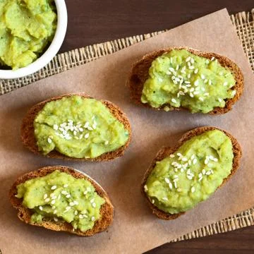 Bread with Green Pea Spread and Sesame Seeds Stock Photos