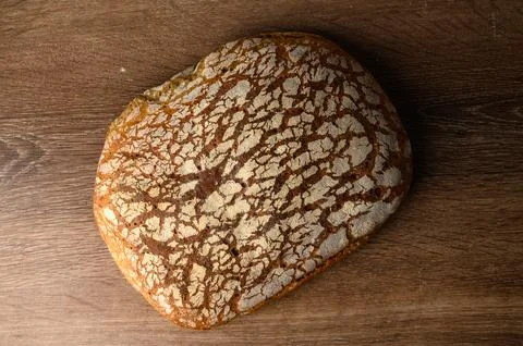 Bread handmade on beige background. Flat lay, top view, copy space Stock Photos