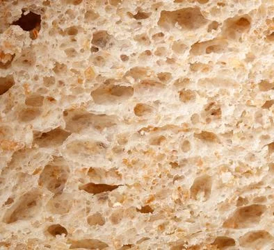 The bread has a rough texture with holes in it Foto stock
