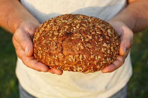 Bread in his hands Stock Photos