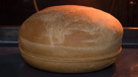 Bread in home oven Stock Photos