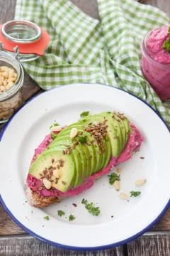 Bread with hummus and avocado Stock Photos
