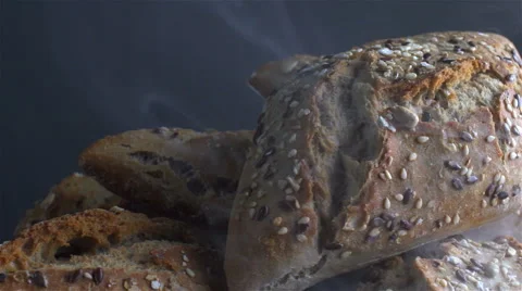 Bread isolated rotating on gray background with smoke Stock Footage 62402710