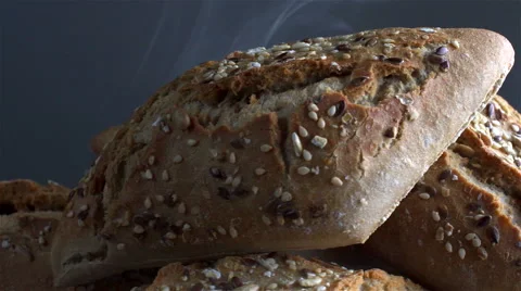 Bread isolated rotating on gray background with smoke Stock Footage 62402861