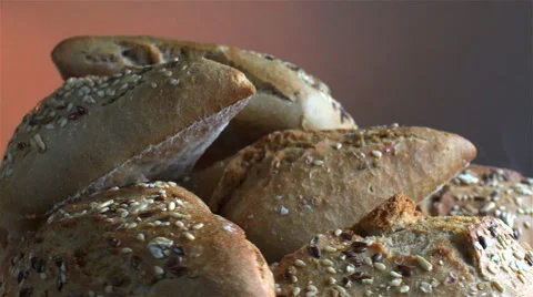 Bread isolated rotating on gray/brown background with smoke Stock Footage 62401730