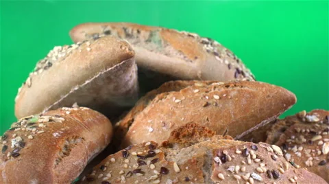 Bread isolated rotating on green background with smoke Video stock 62402510
