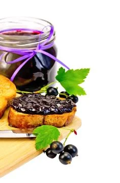 Bread with jam from blackcurrant Slices of toasted bread, a glass jar with... Stock Photos