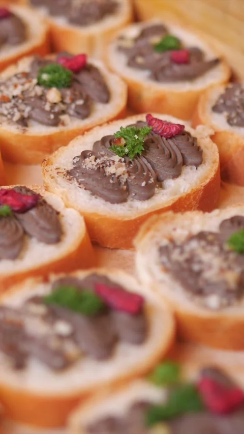 Bread with liver spread at a wedding reception, elegantly displayed, vertical Видео 332815951