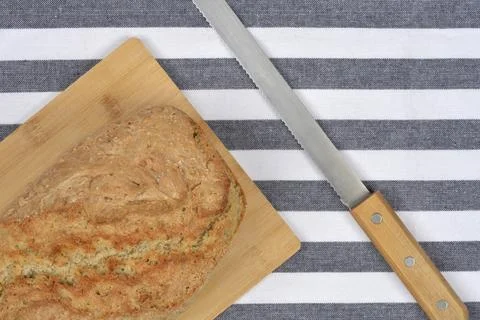 Bread Loaf and Knife Diagonal Stock Photos