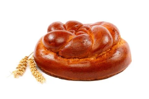 Bread loaf and wheat ear on a white background. Stock Photos