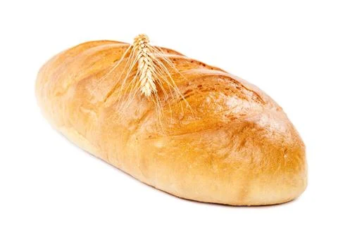 Bread loaf and wheat ear on white background. Stock Photos